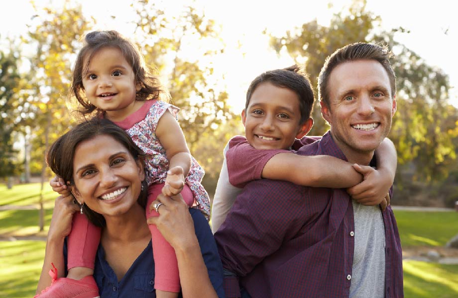 young family with two children outside