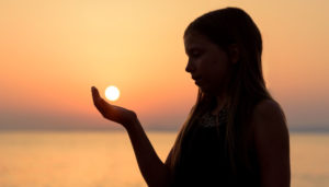 girl holding the sun